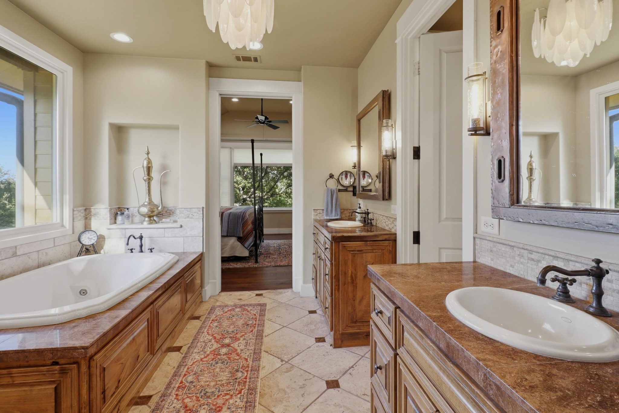 Well-appointed primary bath provides space to unwind at the end of the day.