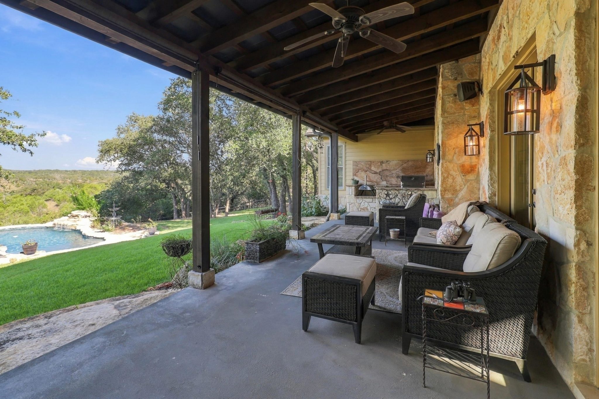 Covered outdoor living expands the home's entertaining space well beyond its walls.