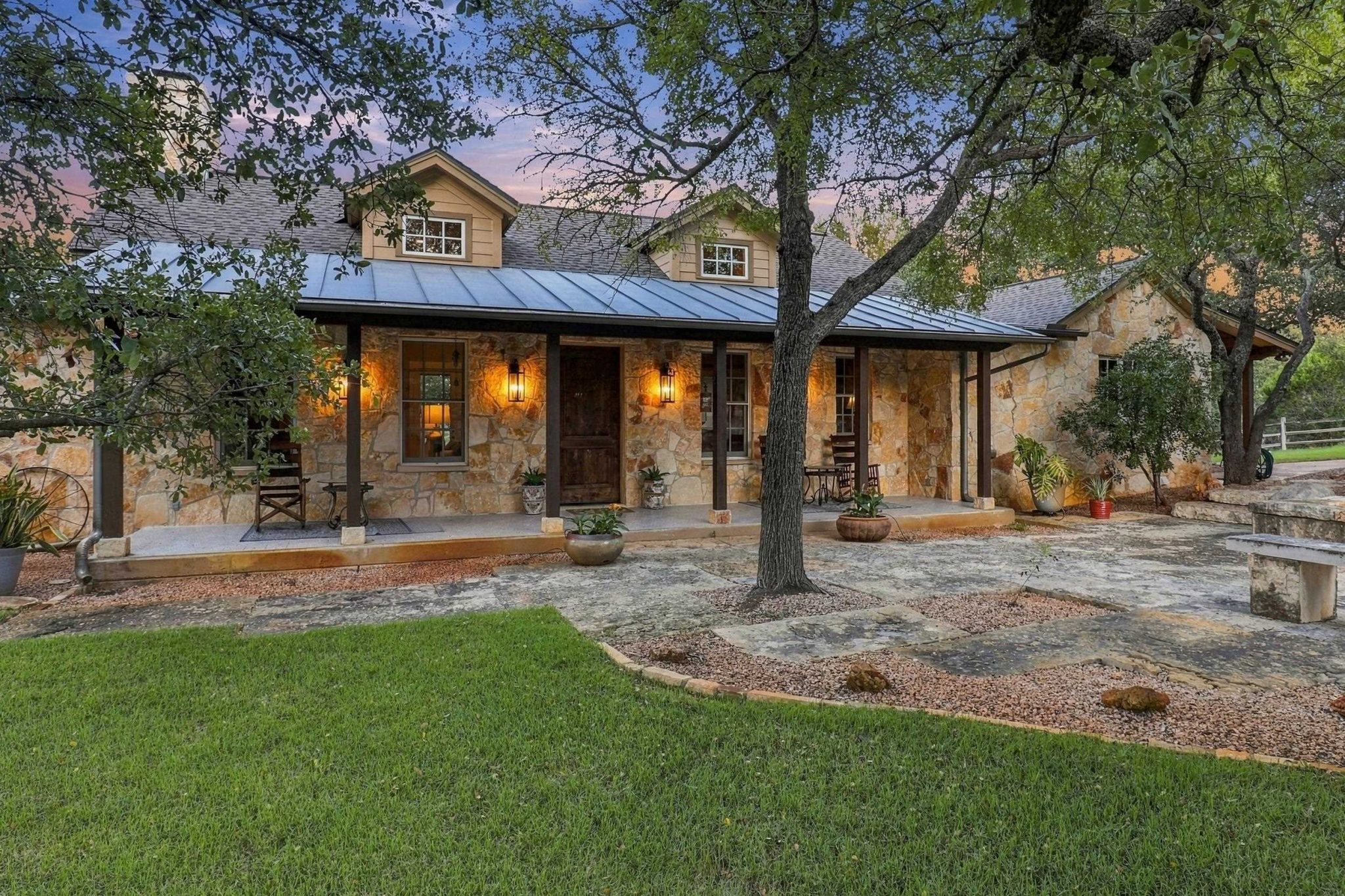 An inviting covered porch offers another place to slow down and enjoy the setting.
