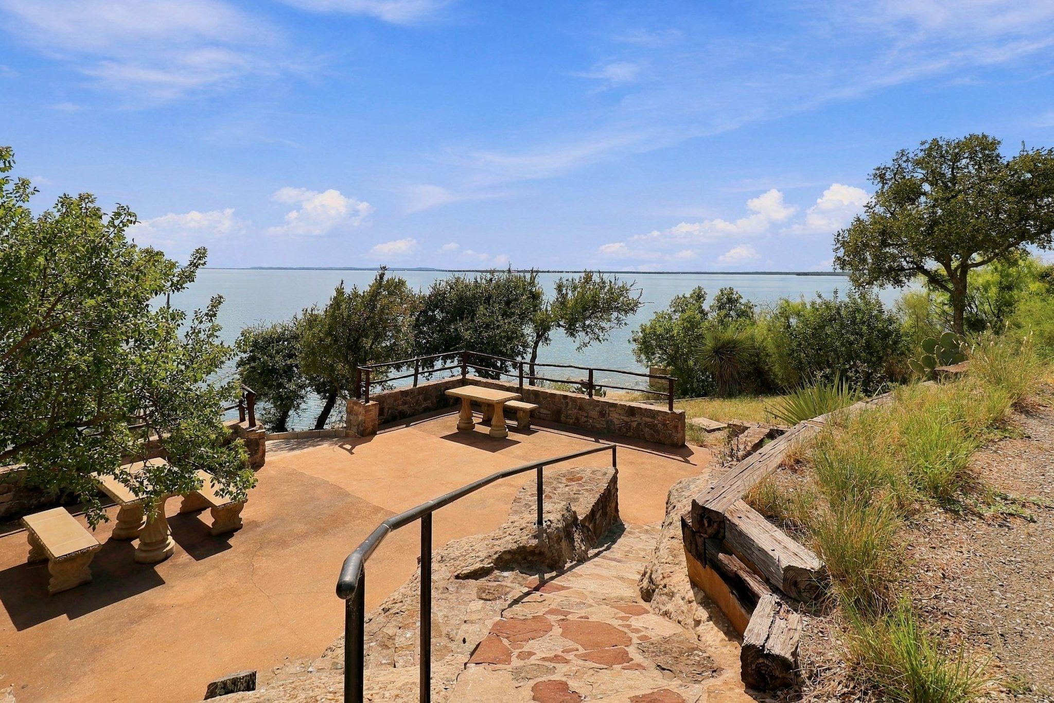 Stone terraces, built-in seating and Hill Country surroundings
