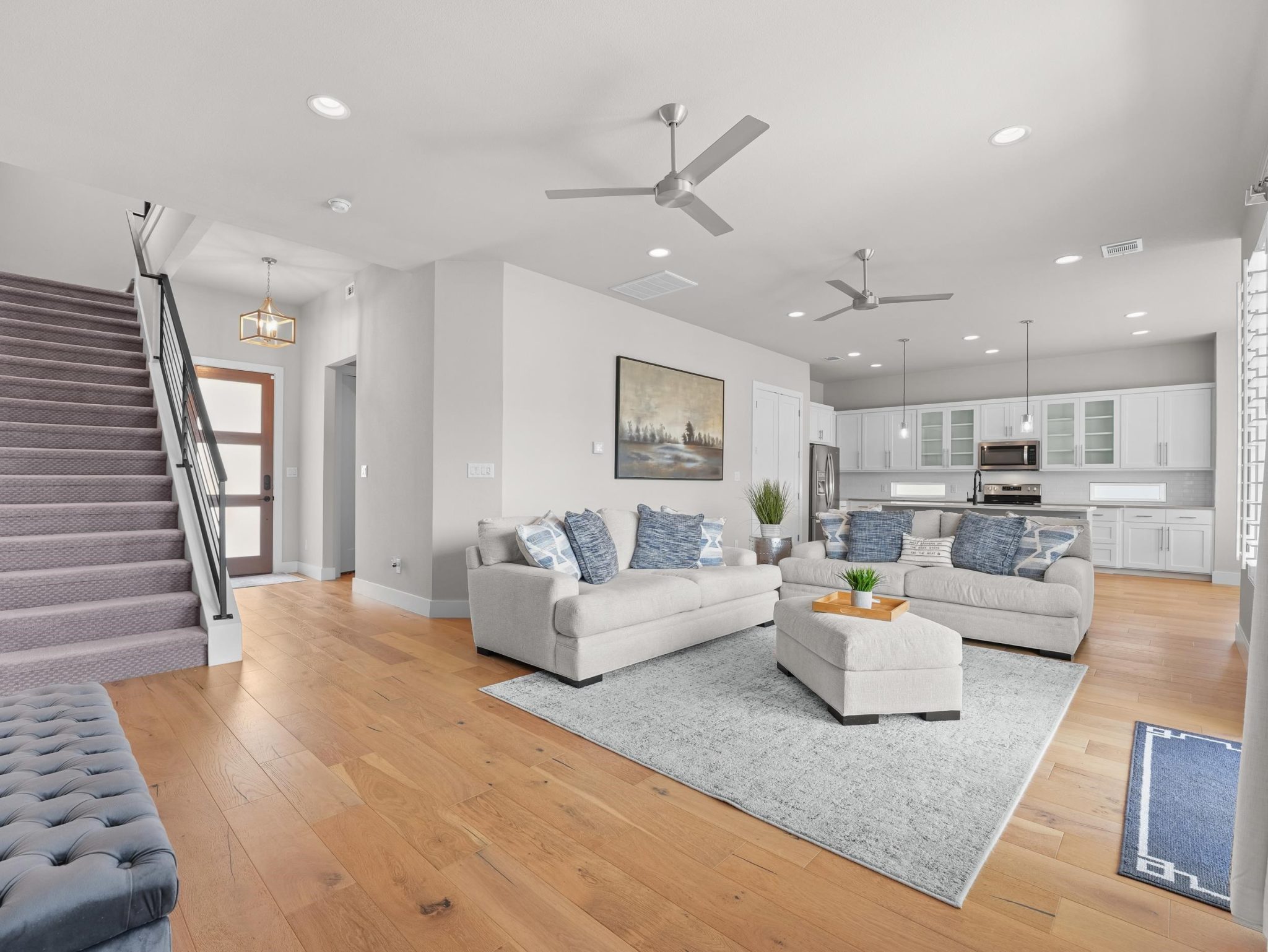 Warm hardwood floors complement the seamless connection between this open living space