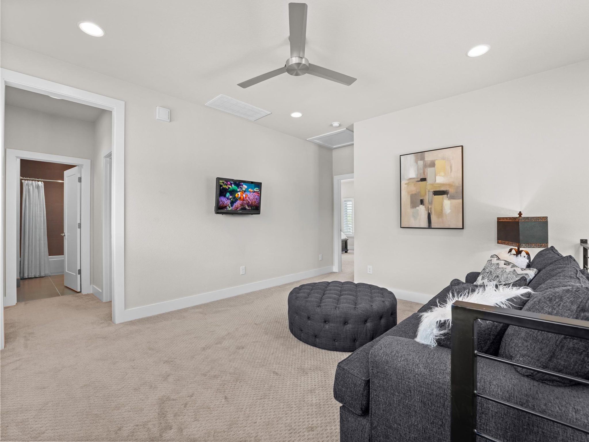 Recessed lighting and soft carpeting define this versatile upper-level living space.
