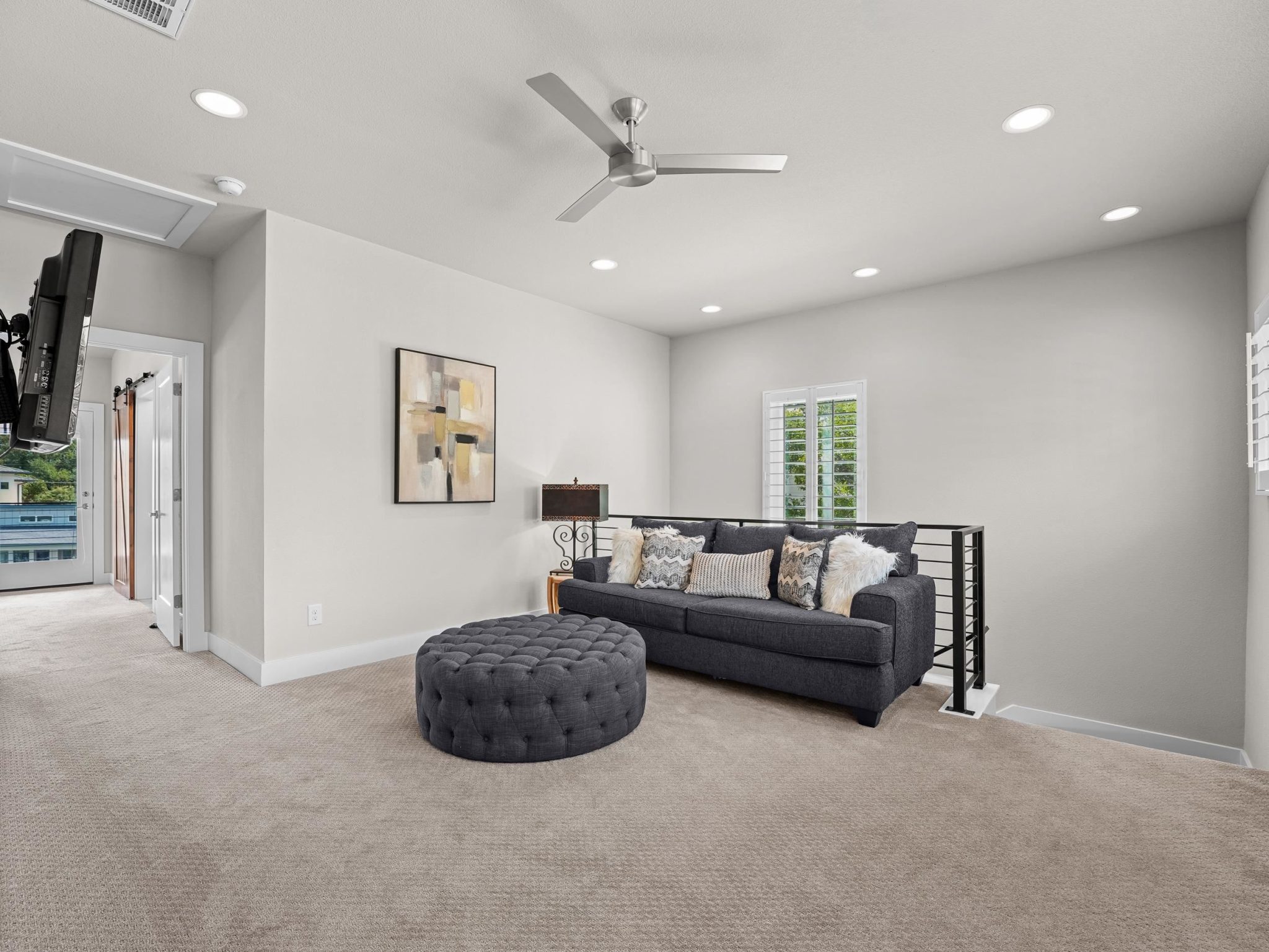 Plush carpeting anchors this versatile upper-level living area.
