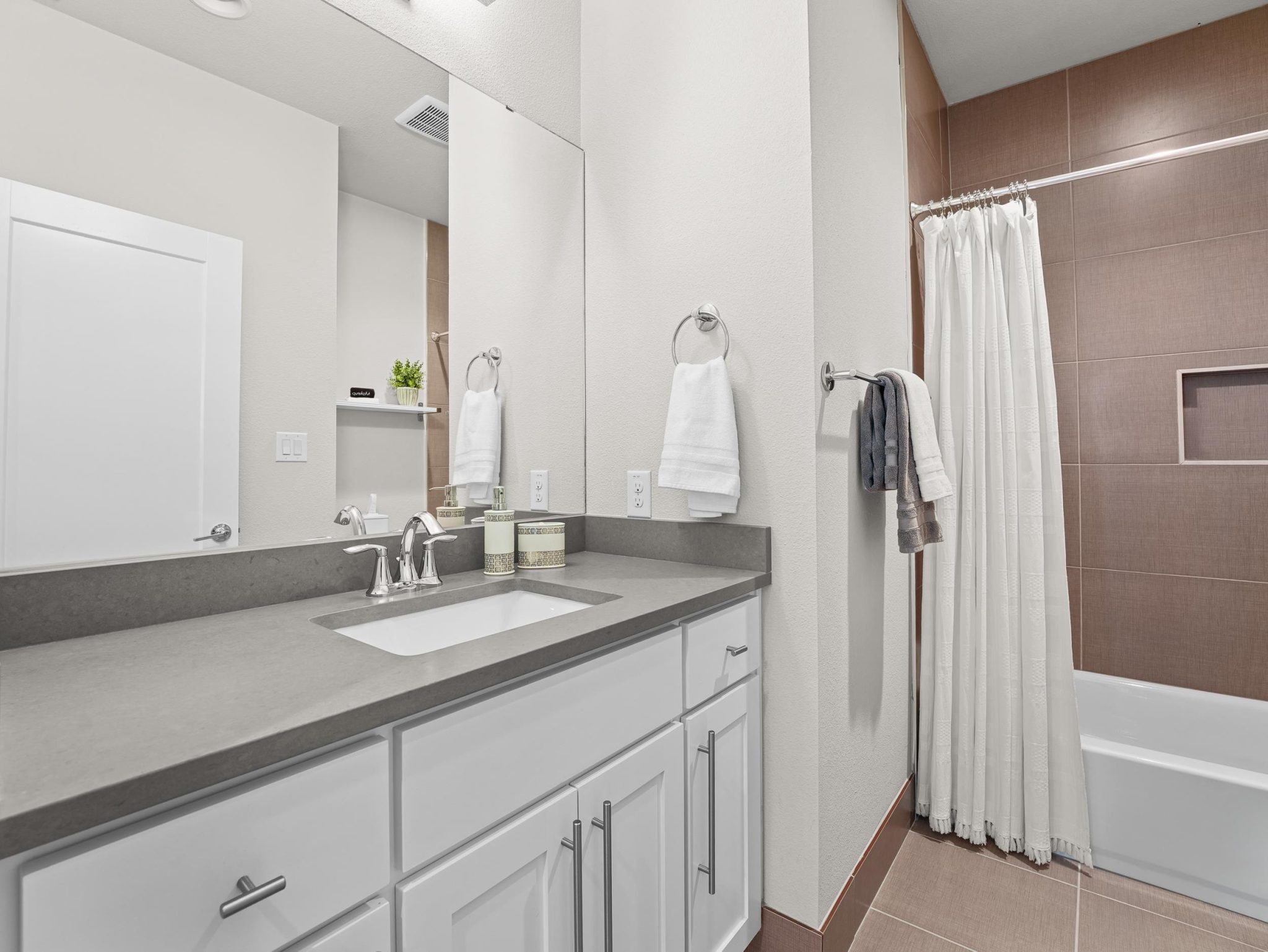 Clean lines and modern tile surround define this contemporary bathroom space.