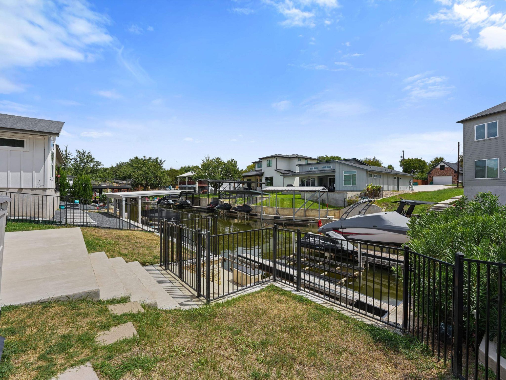A private boat slip provides direct water access from this terraced waterfront property.