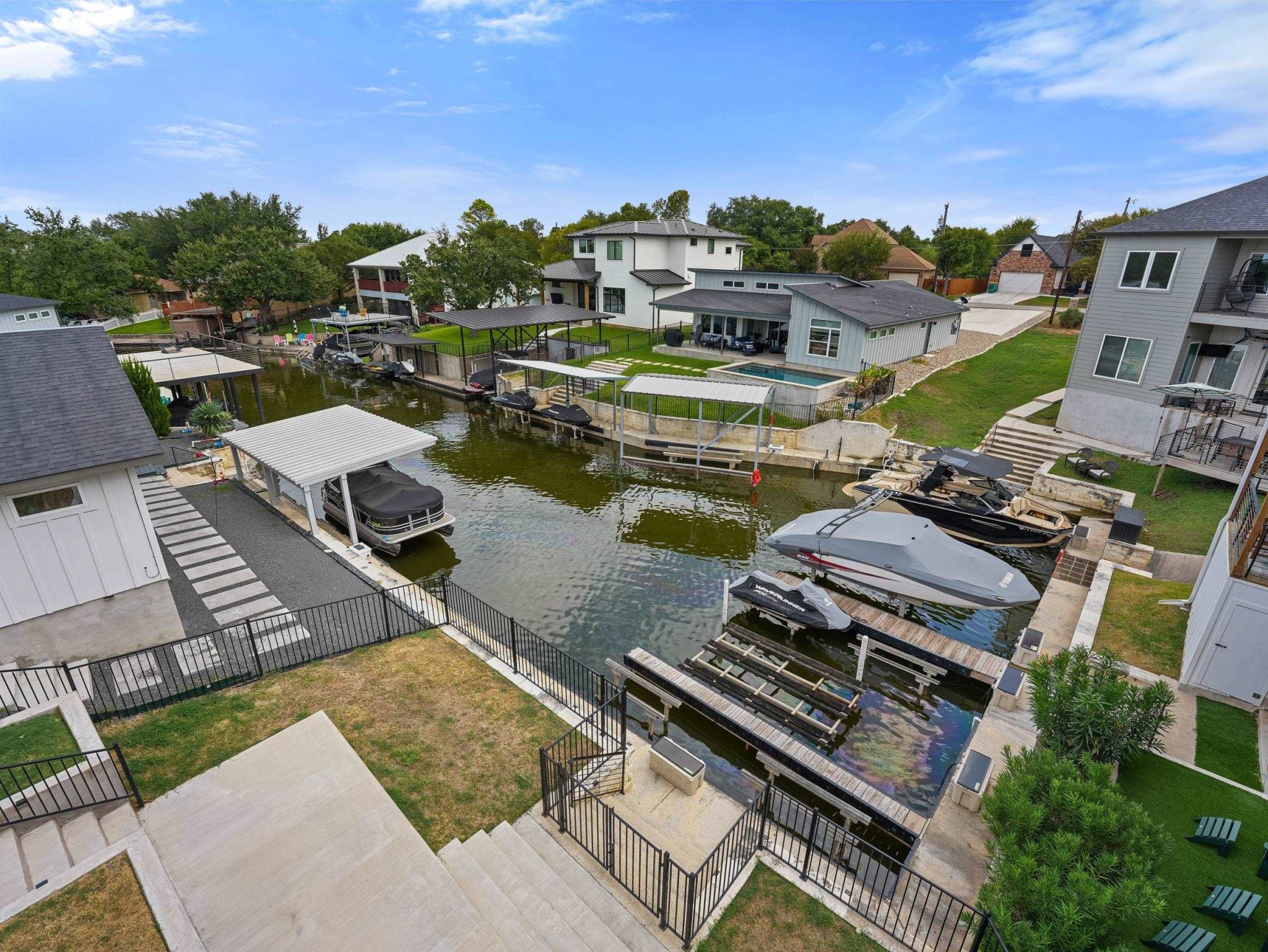 Private docks line this protected canal with direct access to open water.